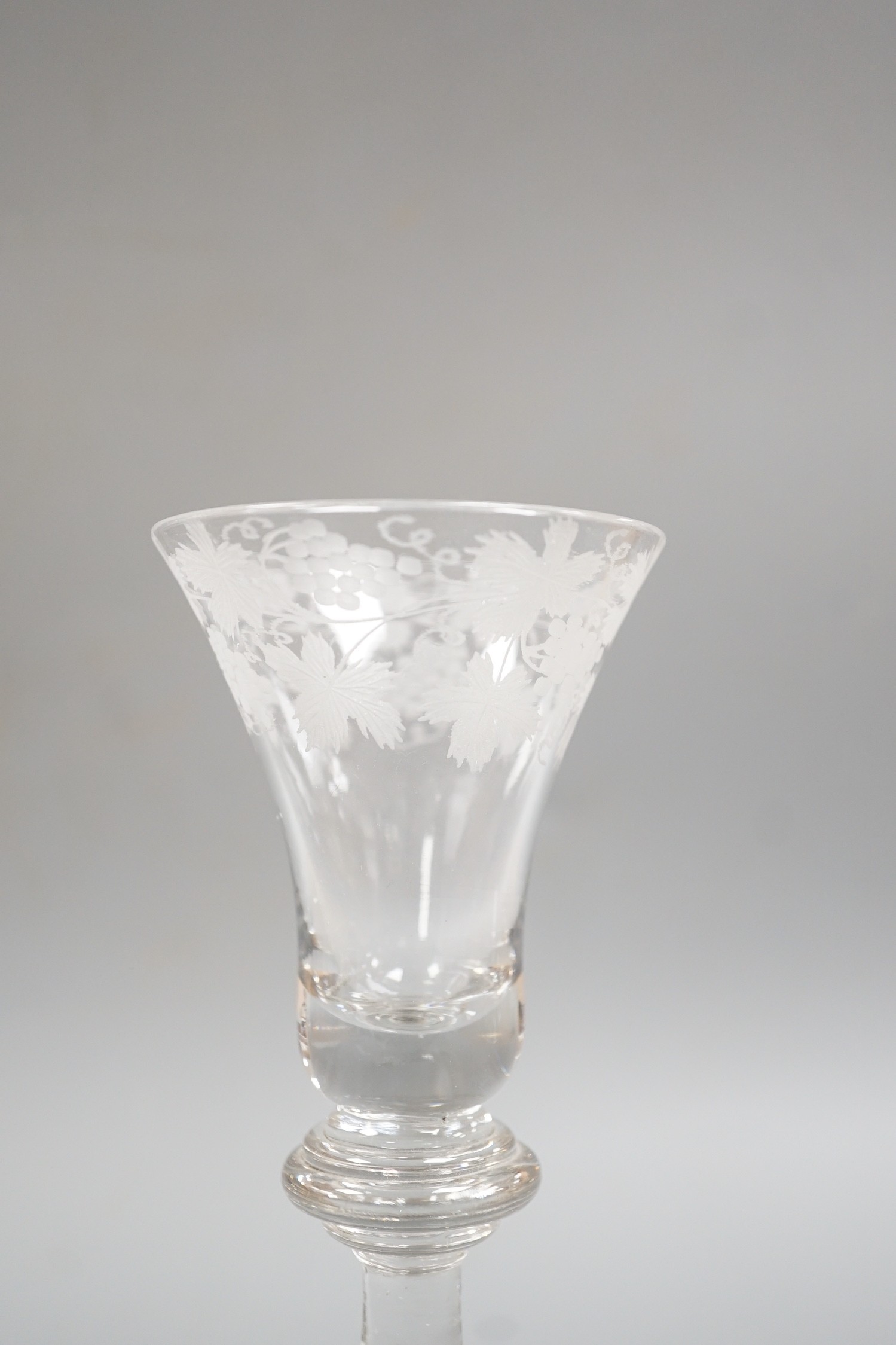 An engraved baluster stem wine glass, 17cm